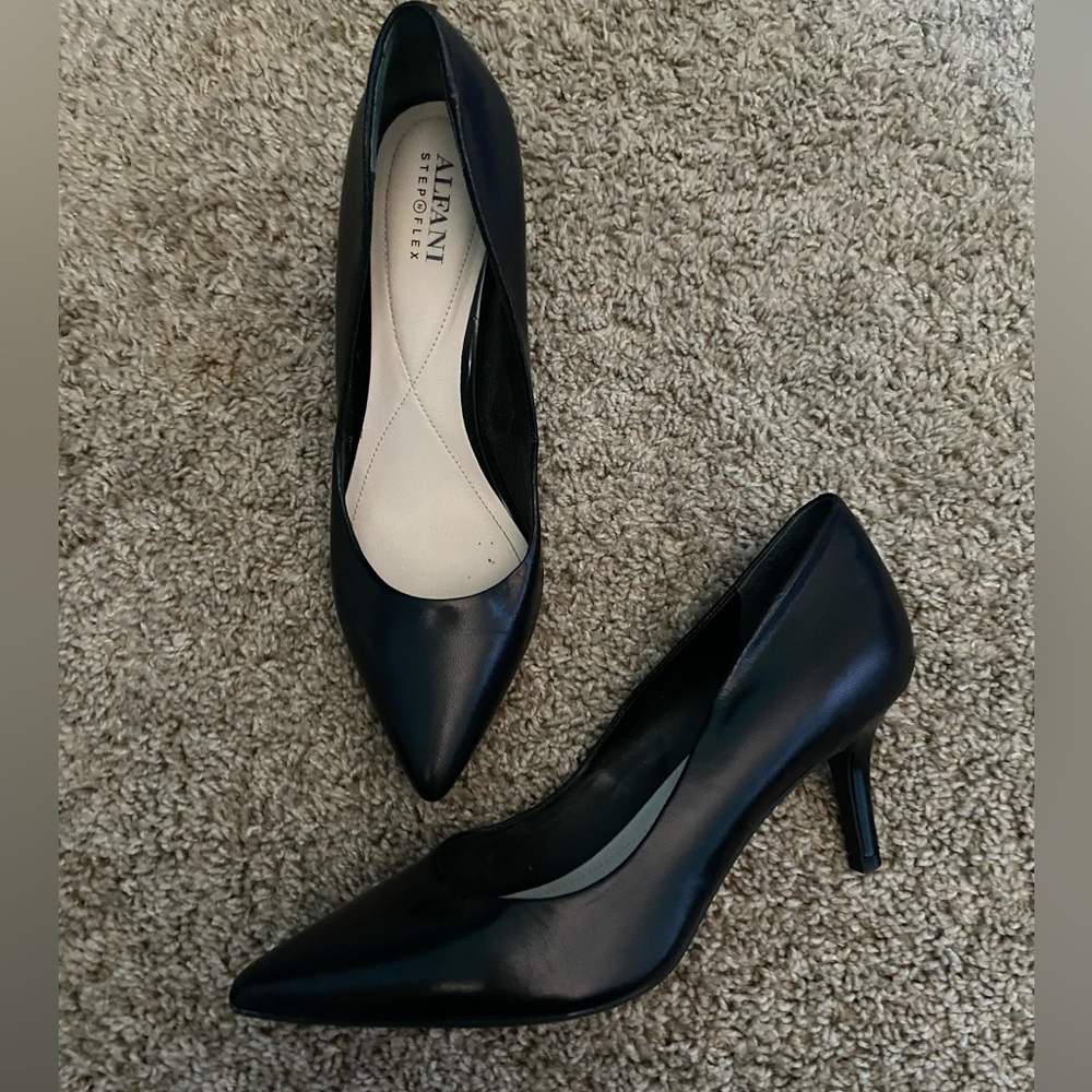 Black pointed toe heels.